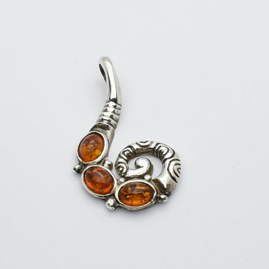 Sterling Silver Pendant With Amber Stones.