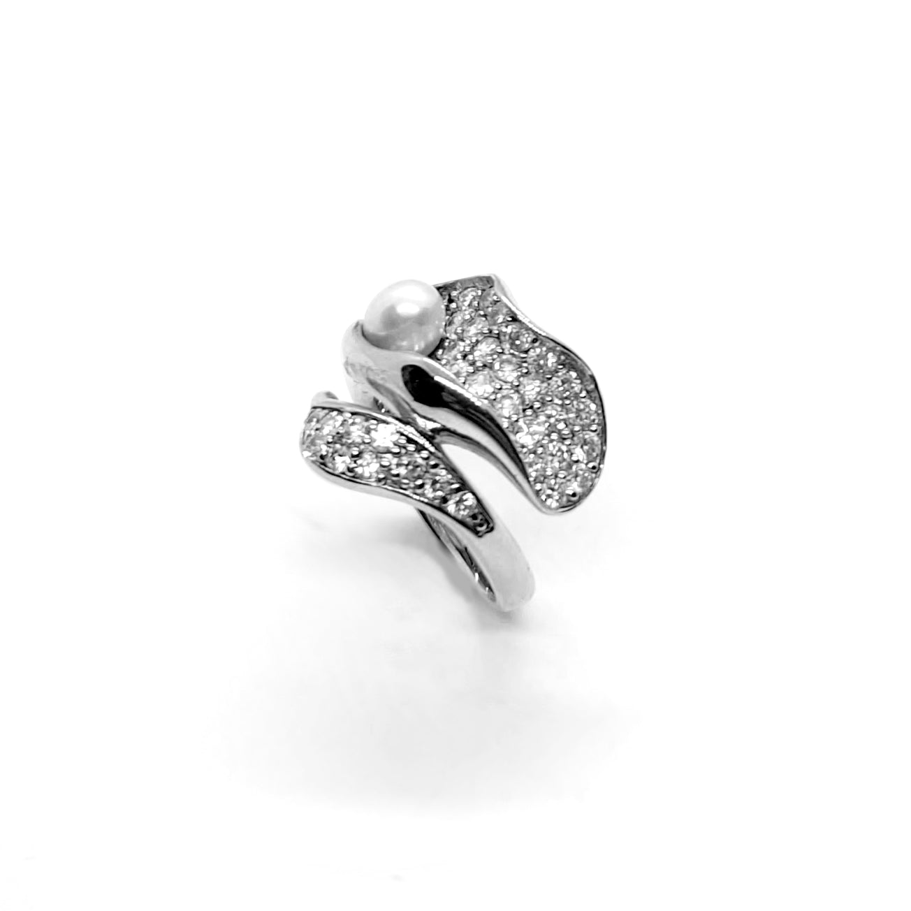 Sculptural sterling silver white rhodium plated wrap ring with pavé cubic zirconia and a single freshwater pearl.